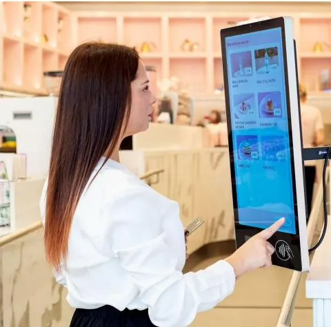 Guest placing an order on a Kate One kiosk