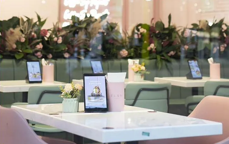Kate One terminals on caf&eacute; tables