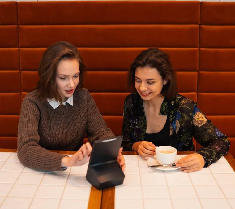 Guests paying at the table on a Kate One terminal
